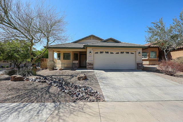 28604 N 21st Ln, Phoenix, AZ 85085 - view of front of home featuring stone siding, driveway, a garage, and stucco siding