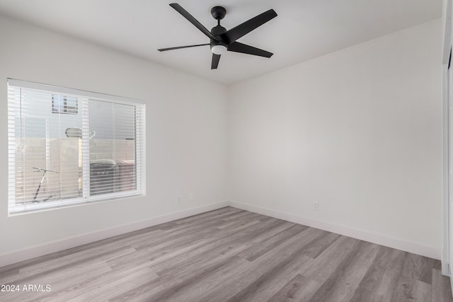 10338 E San Salvador Dr, Scottsdale, AZ 85258 - unfurnished room with wood finished floors, ceiling fan, and baseboards