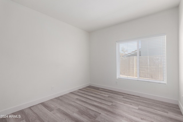10338 E San Salvador Dr, Scottsdale, AZ 85258 - empty room with light wood-style flooring and baseboards