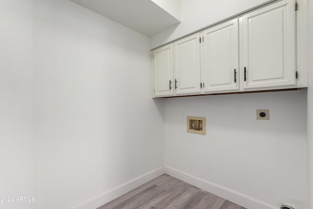 10338 E San Salvador Dr, Scottsdale, AZ 85258 - laundry room with cabinet space, hookup for an electric dryer, baseboards, washer hookup, and light wood-style floors