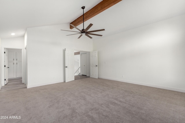 10338 E San Salvador Dr, Scottsdale, AZ 85258 - spare room featuring light carpet, a ceiling fan, beam ceiling, baseboards, and high vaulted ceiling