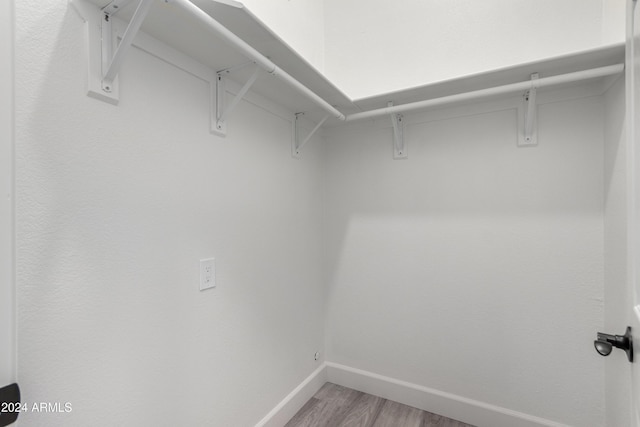 10338 E San Salvador Dr, Scottsdale, AZ 85258 - walk in closet featuring light wood finished floors