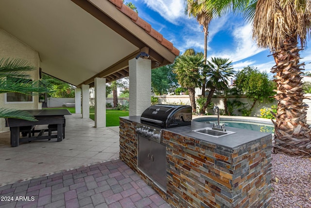 10338 E San Salvador Dr, Scottsdale, AZ 85258 - view of patio featuring exterior kitchen, a sink, fence, and a grill