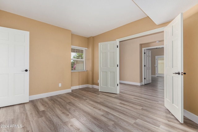 unfurnished bedroom featuring light hardwood / wood-style floors