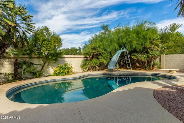 10338 E San Salvador Dr, Scottsdale, AZ 85258 - view of pool with a fenced backyard and a water slide