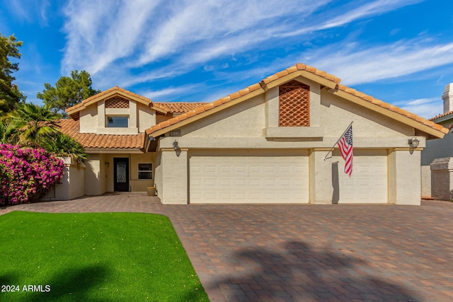 10338 E San Salvador Dr, Scottsdale, AZ 85258 - view of front of property with an attached garage, stucco siding, decorative driveway, and a tile roof