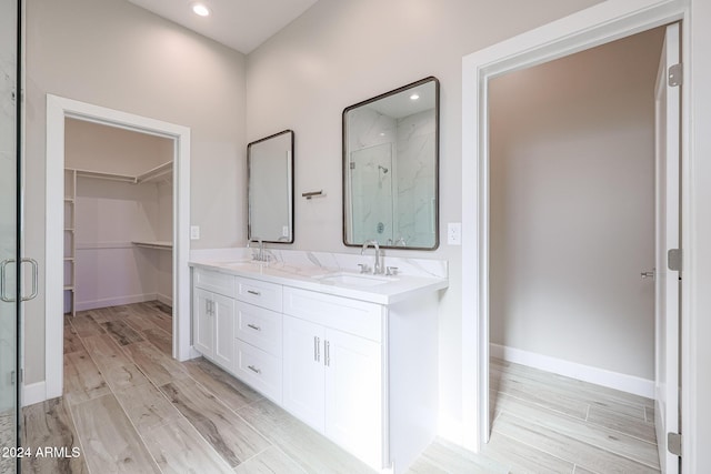 bathroom with vanity and walk in shower