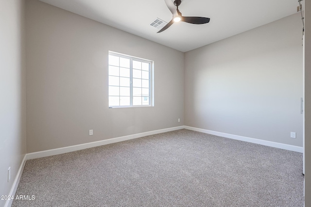 empty room with carpet flooring and ceiling fan