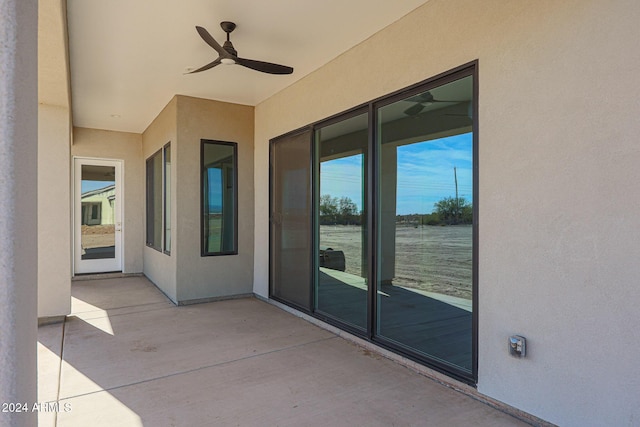 view of patio / terrace featuring ceiling fan