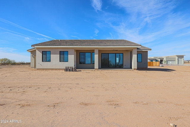 back of house featuring ceiling fan