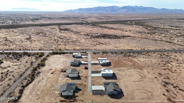 birds eye view of property with a mountain view