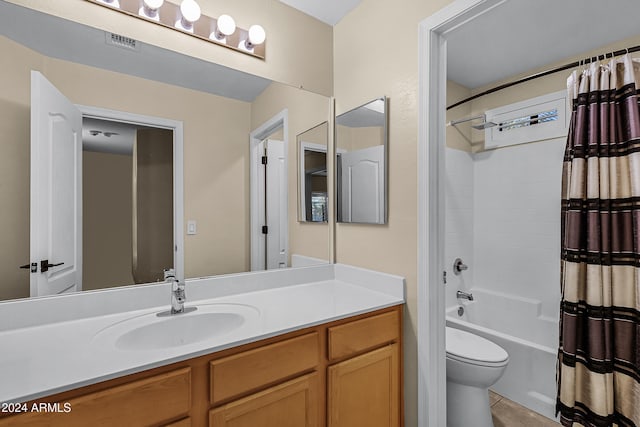 full bathroom with tile patterned floors, vanity, shower / bath combo, and toilet