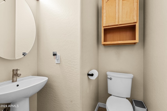 bathroom with toilet and sink