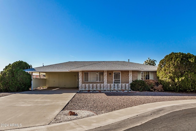 view of front of property with a carport and a porch