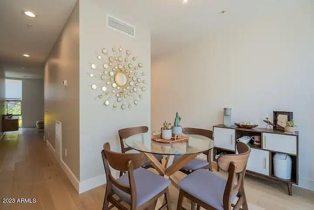 dining area with recessed lighting, light wood-type flooring, visible vents, and baseboards