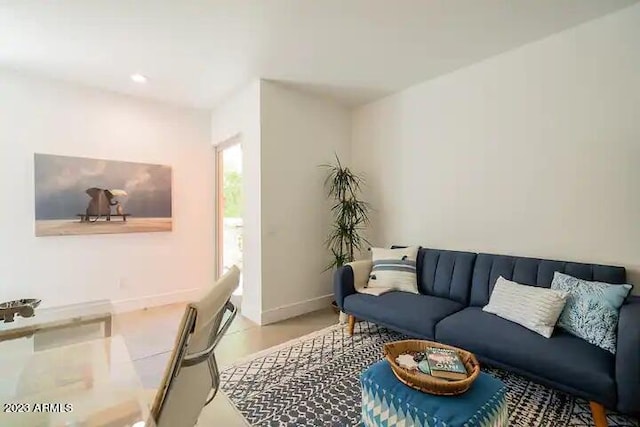 living room featuring recessed lighting and baseboards