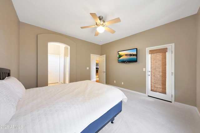16600 N Thompson Peak Pkwy Unit 2006, Scottsdale, AZ 85260 - bedroom featuring light colored carpet, baseboards, arched walkways, and a ceiling fan