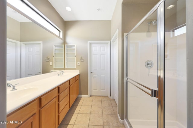 16600 N Thompson Peak Pkwy Unit 2006, Scottsdale, AZ 85260 - full bathroom with a stall shower, double vanity, tile patterned flooring, and baseboards