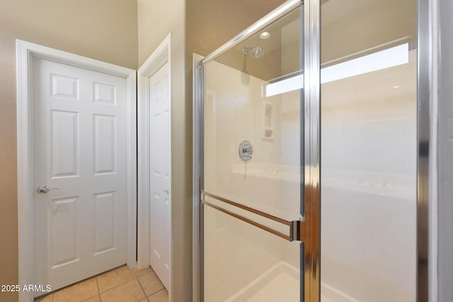 16600 N Thompson Peak Pkwy Unit 2006, Scottsdale, AZ 85260 - bathroom featuring a stall shower and tile patterned flooring