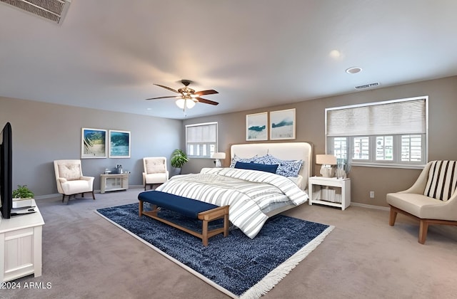 carpeted bedroom with ceiling fan