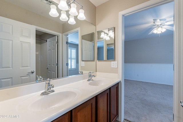 bathroom with double vanity and ceiling fan