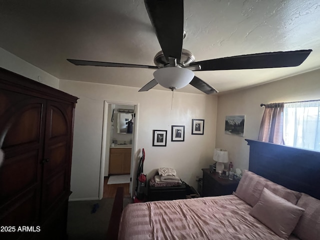 bedroom with ceiling fan and ensuite bathroom