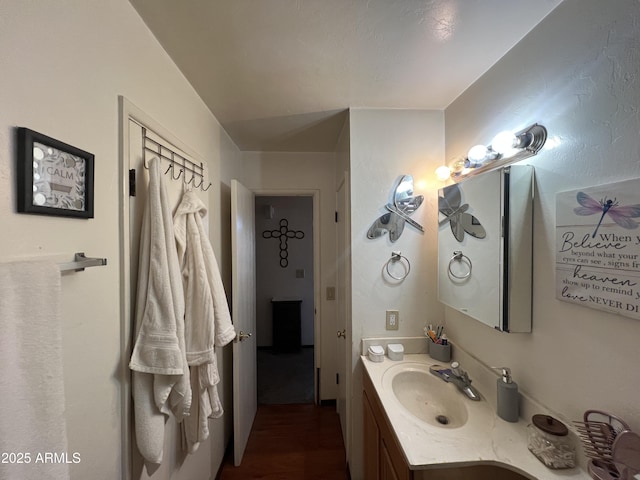 bathroom with vanity and hardwood / wood-style flooring