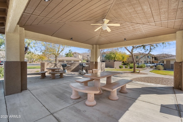 view of patio / terrace with ceiling fan, area for grilling, and a gazebo