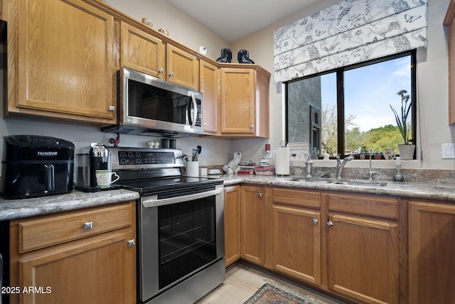 kitchen with appliances with stainless steel finishes and sink