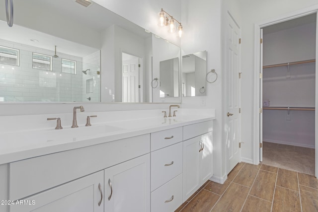 bathroom with vanity and an enclosed shower