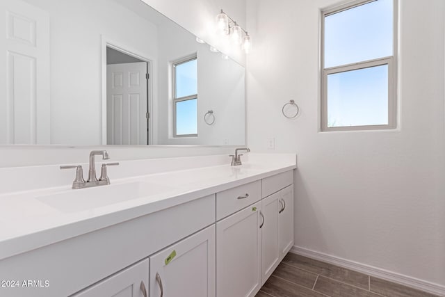 bathroom featuring vanity and hardwood / wood-style floors