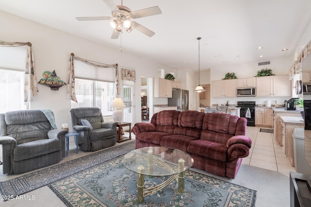 living room with ceiling fan and recessed lighting