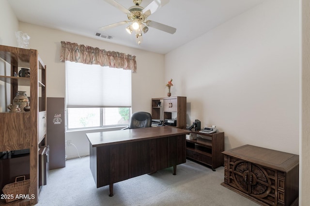 office area with light carpet and a ceiling fan
