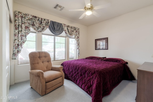 carpeted bedroom featuring baseboards and ceiling fan