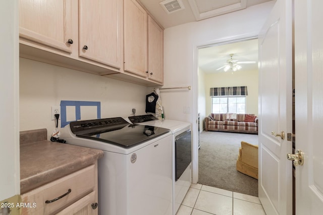 laundry area with cabinet space, washing machine and clothes dryer, light tile patterned floors, light carpet, and a ceiling fan