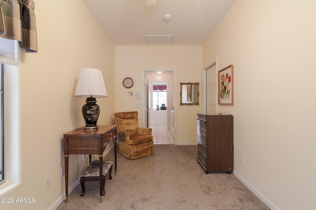living area with carpet flooring and baseboards