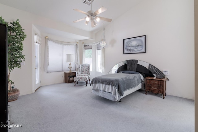 carpeted bedroom featuring lofted ceiling, baseboards, and a ceiling fan