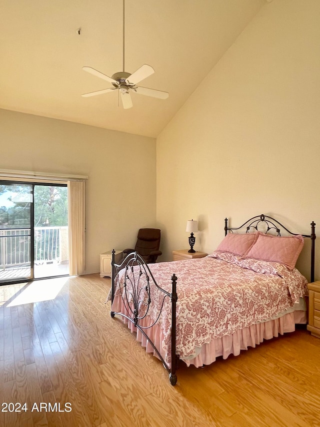 bedroom featuring ceiling fan, access to exterior, lofted ceiling, and wood-type flooring