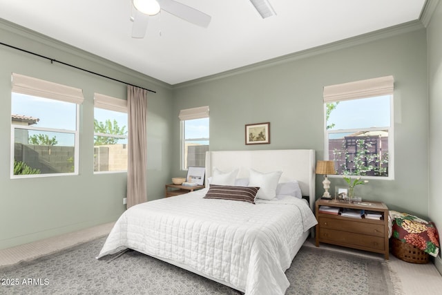 carpeted bedroom with visible vents, ornamental molding, and multiple windows