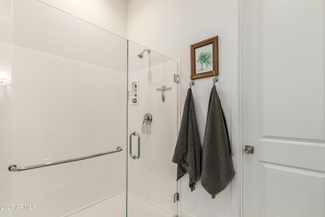 full bath featuring a shower stall