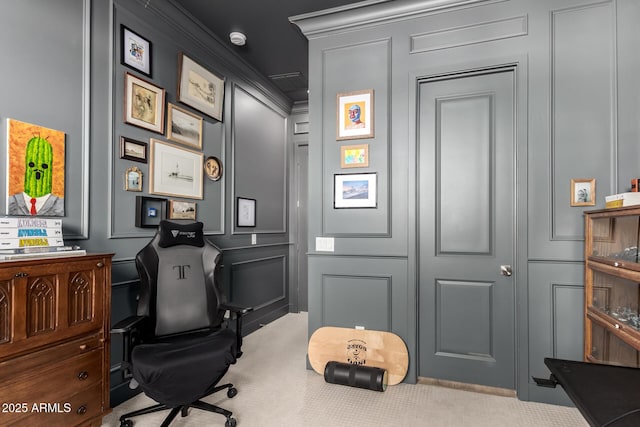 office featuring carpet and a decorative wall