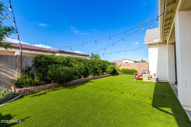 view of yard featuring a fenced backyard