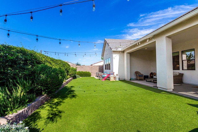 view of yard with a fenced backyard and a patio area
