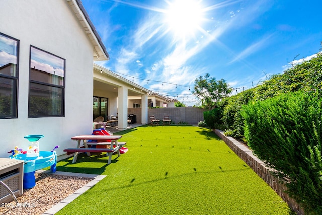 view of yard featuring a patio and a fenced backyard