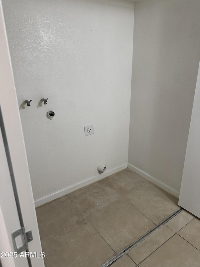 laundry room featuring light tile patterned floors and electric dryer hookup