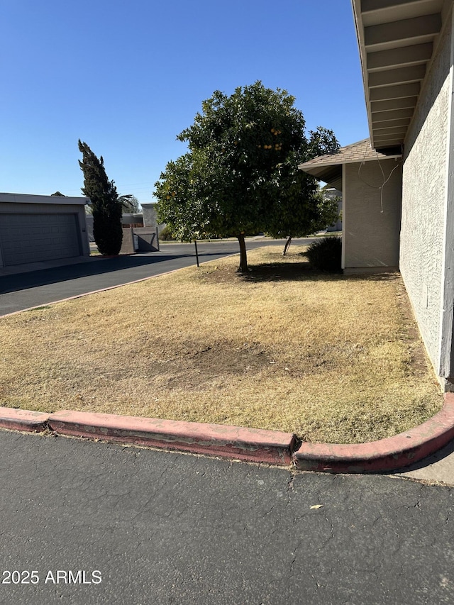 view of yard featuring a garage