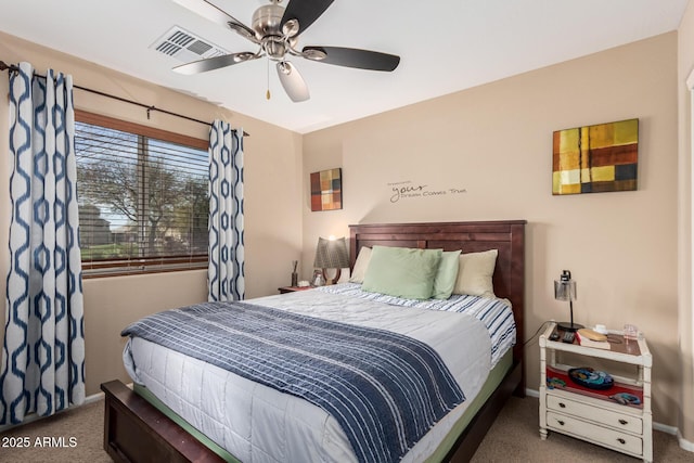 bedroom featuring ceiling fan, visible vents, dark colored carpet, and baseboards