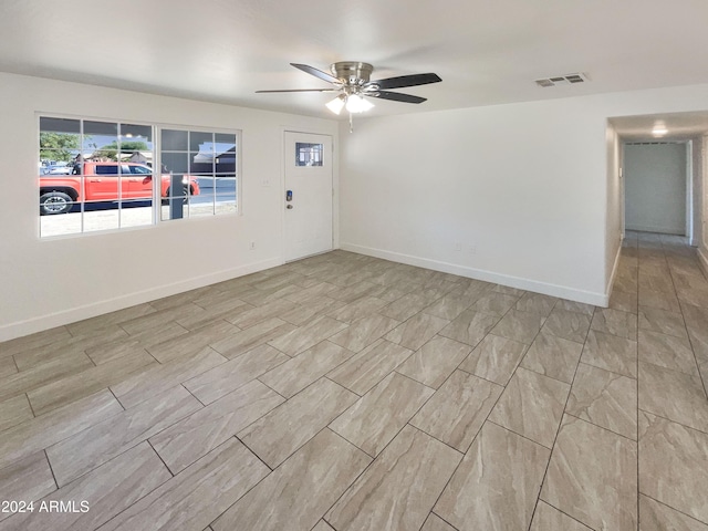 empty room featuring ceiling fan