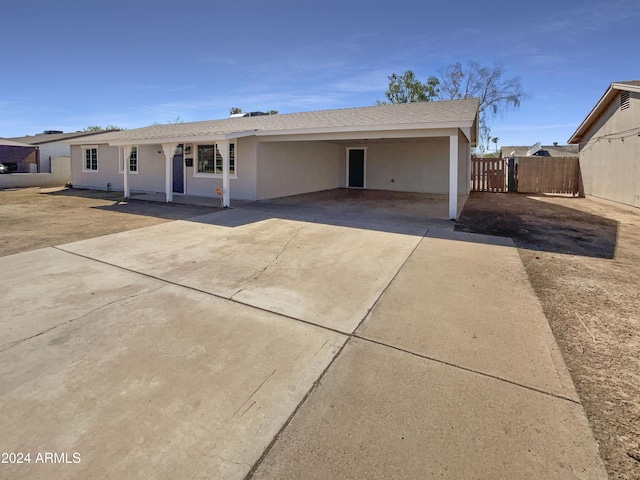 view of front of home with a carport