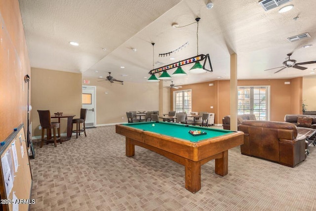 game room featuring ceiling fan, light colored carpet, a textured ceiling, and billiards